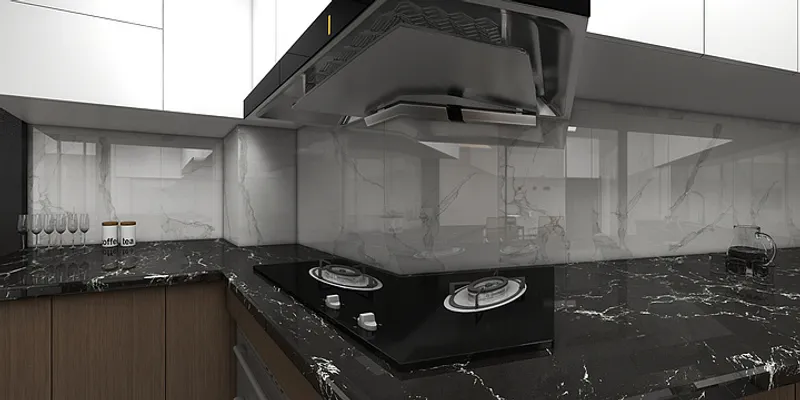 Modern kitchen corner showing black marble countertop with gas stove and white marble wall panel