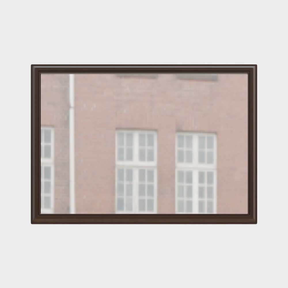 Rectangular dark brown wood framed mirror reflecting red brick wall with white windows on light grey background