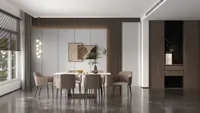 Spacious dining room with dark marble floor beige chairs marble table wall panels and art