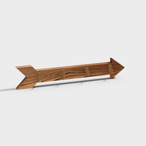 Rustic wooden arrow shaped coat rack with four gold hooks on white background