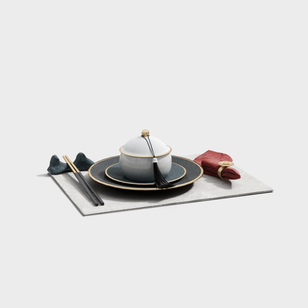 White ceramic tea bowl with gold rim and black tassel on grey placemat
