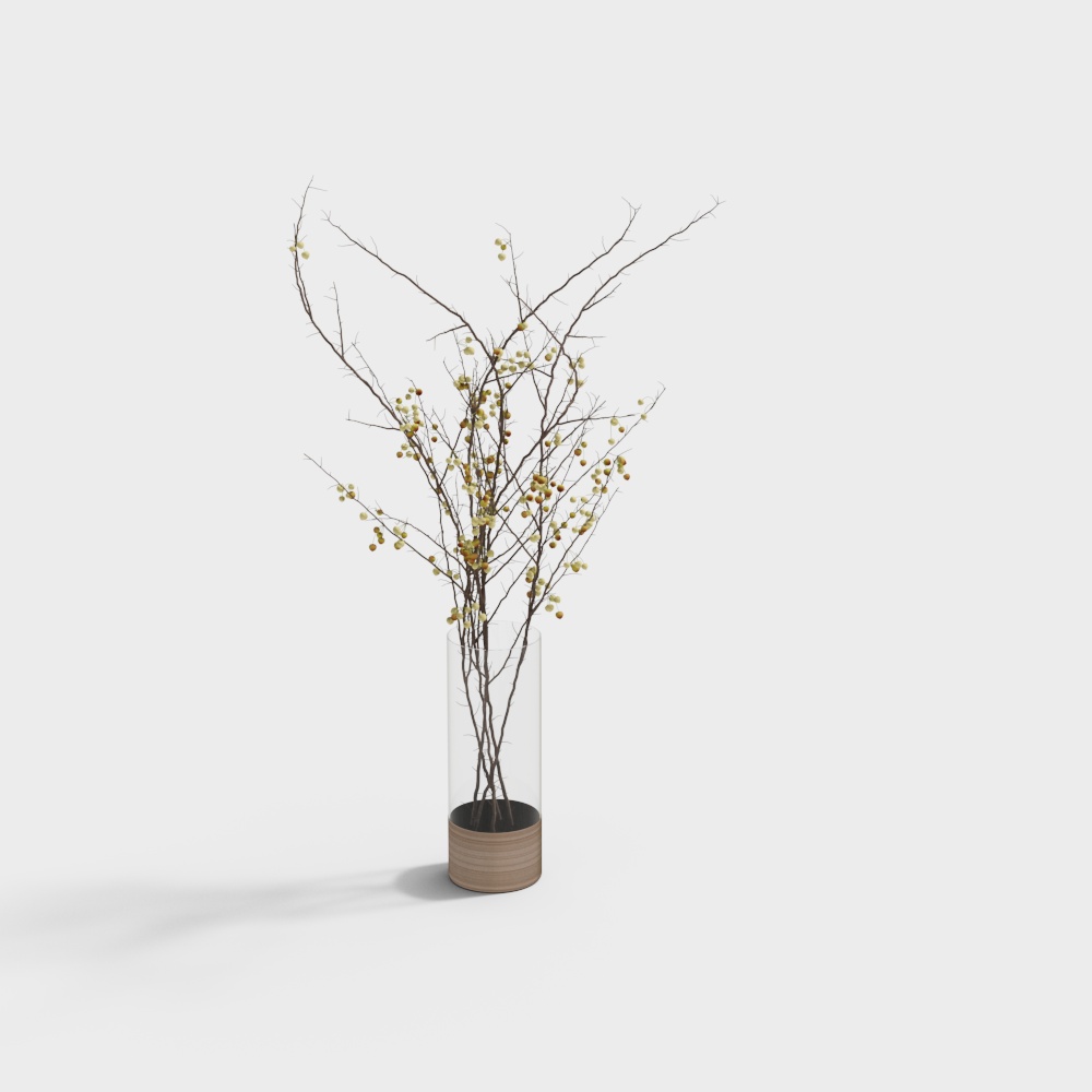 Tall clear glass vase with wood base holding thin branches with yellow berries on white background
