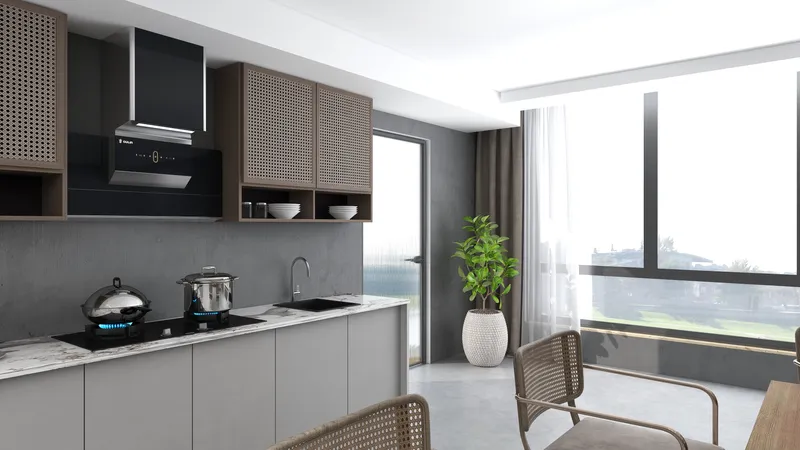 Modern kitchen featuring grey cabinets, marble countertop, black range hood, green plant, and large window