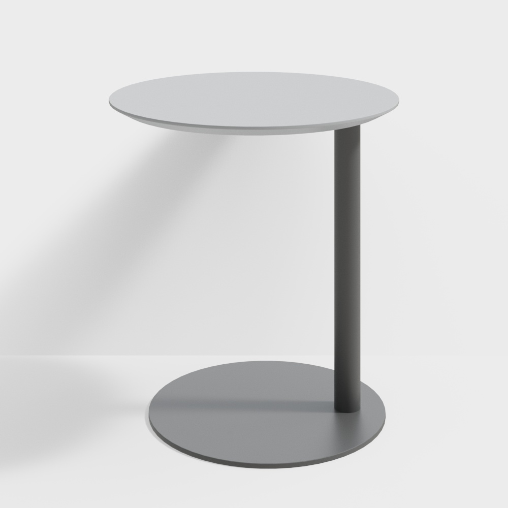 Modern round table with grey top and dark metal leg on white background