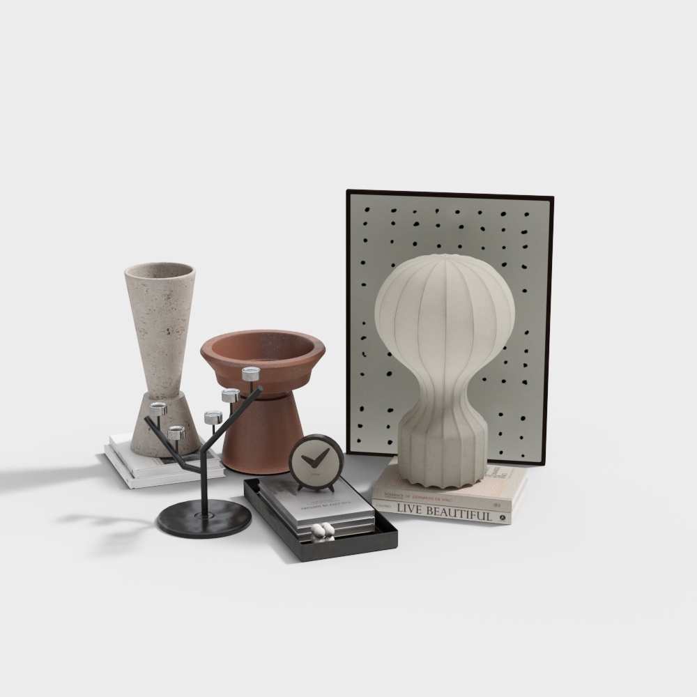 Modern home decor set with vase candle holder clock and books on white background