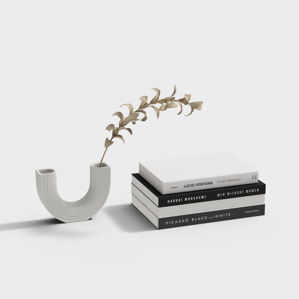 U-shaped white ribbed vase with beige plant and stacked books on grey background