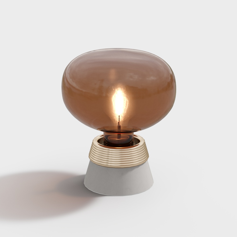 Modern table lamp with brown glass shade and grey concrete base on white background