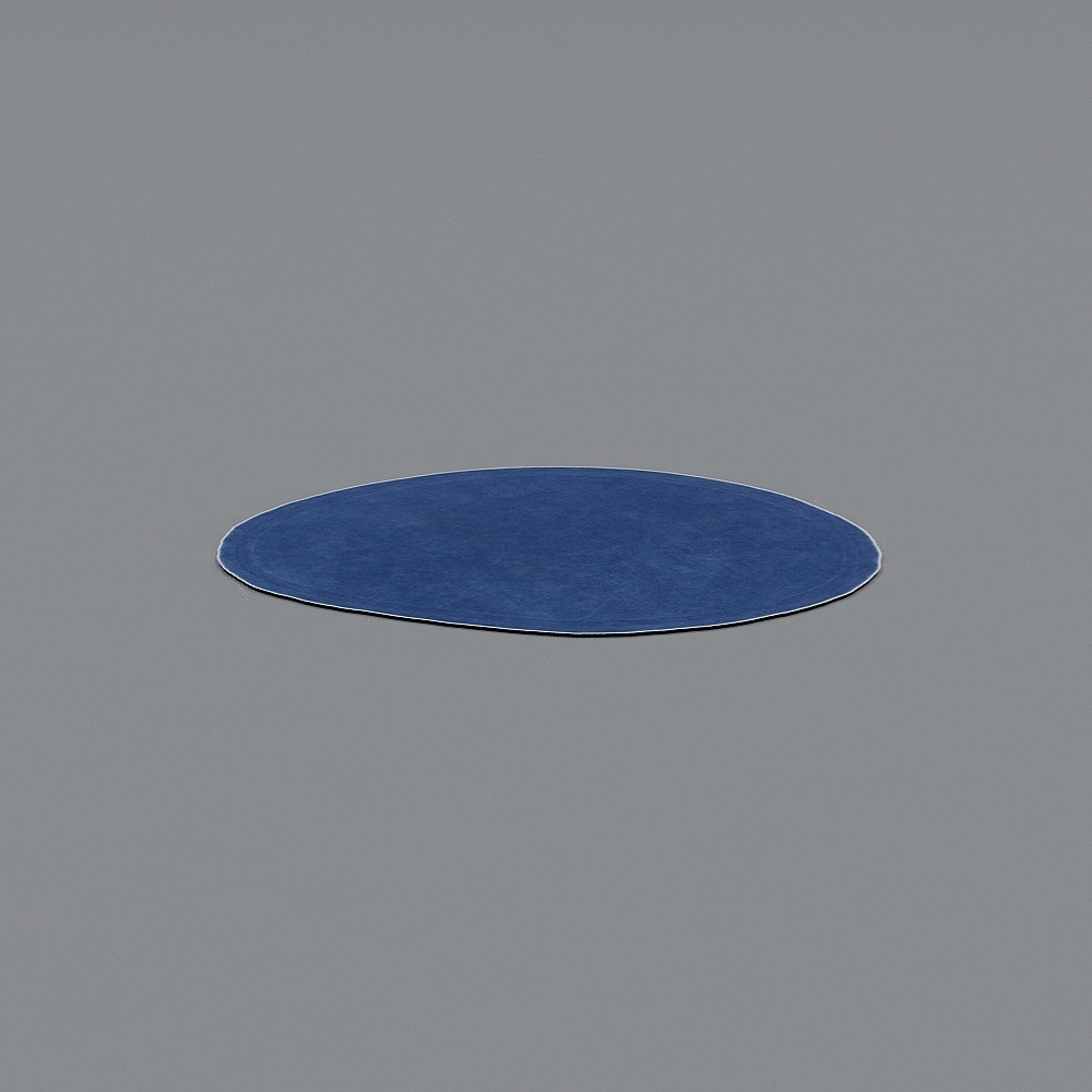 Round blue area rug with soft texture on grey background