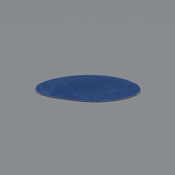 Round blue area rug with soft texture on grey background