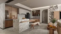 Living room view with marble wall panel wooden small table oranges and kitchen island background